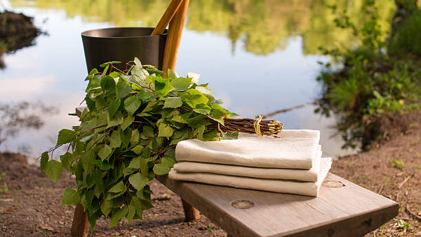 istock Finnish summer landscape and sauna objects on bench by lake. 497227691