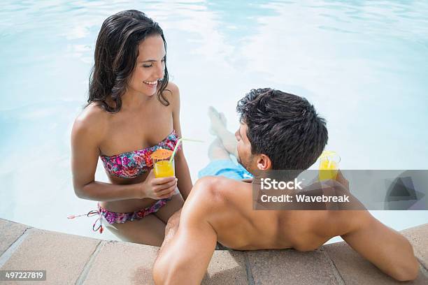 Attractive Couple Drinks Cocktails Stock Photo - Download Image Now - 20-29 Years, Adult, Affectionate