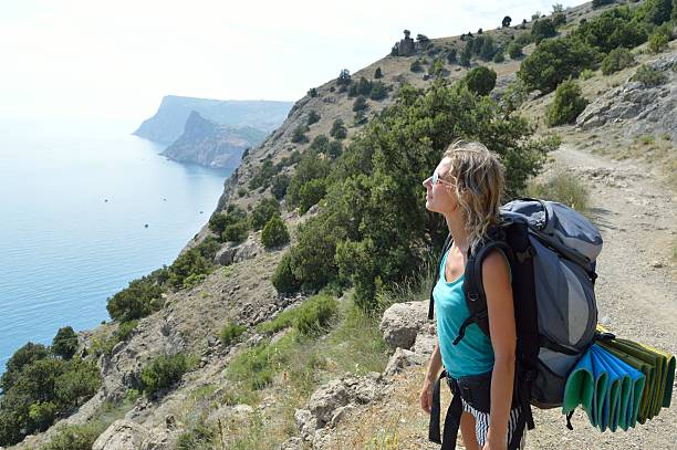 istock Tourist girl in mountains 497228997