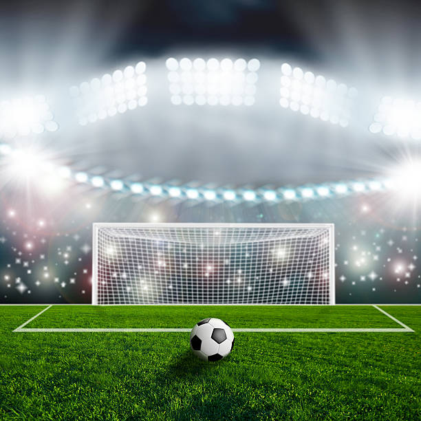 istock Soccer ball on green stadium arena 497229743