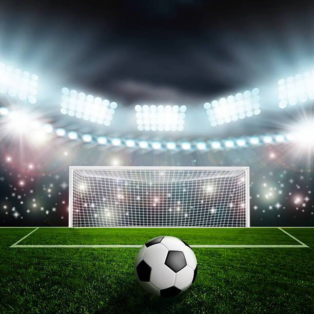 istock Soccer ball on green stadium arena 497229749
