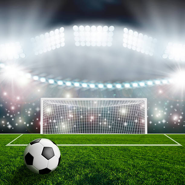 istock Soccer ball on green stadium arena 497229753