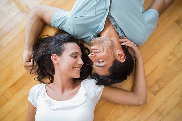 istock Happy couple on the floor together 497230343