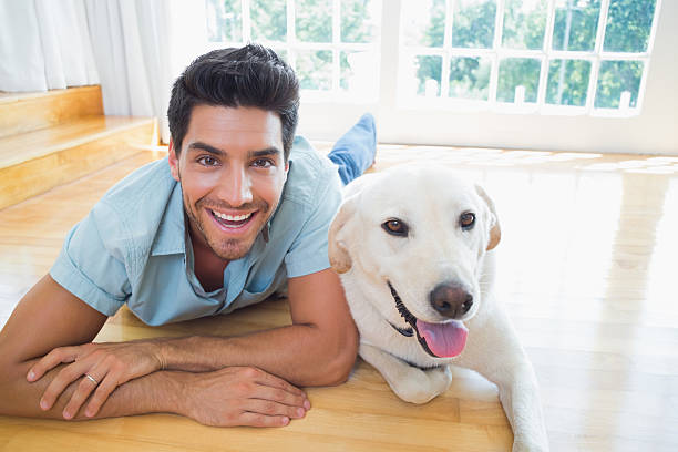 istock Handsome man enjoying his dogs company 497230363