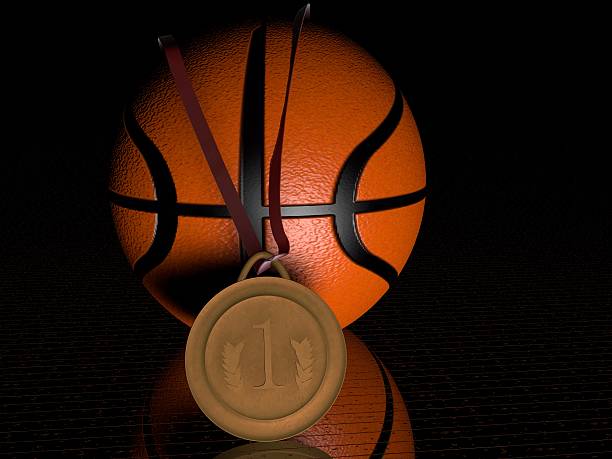 Detail of basketball ball hitting the basket, top view. Isolated on black background. Freeze motion of sport action. Lower angle of view. Vertical aspect ratio.