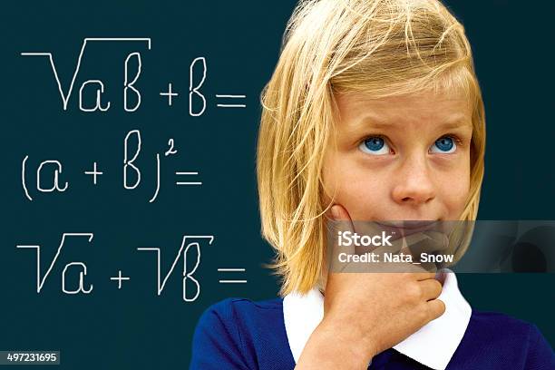 Schoolgirl Ponders Solving A Mathematical Problem Stock Photo - Download Image Now - Adolescence, Report Card, Teenage Girls