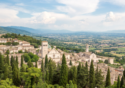 Assisi cityscape with Basilica di Santa Chiara and Assisi Cathedral San Rufino, Umbria Italy