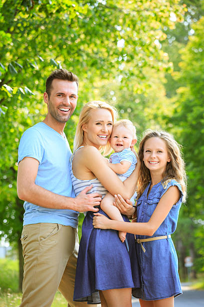 istock Happy family in a park 497241091