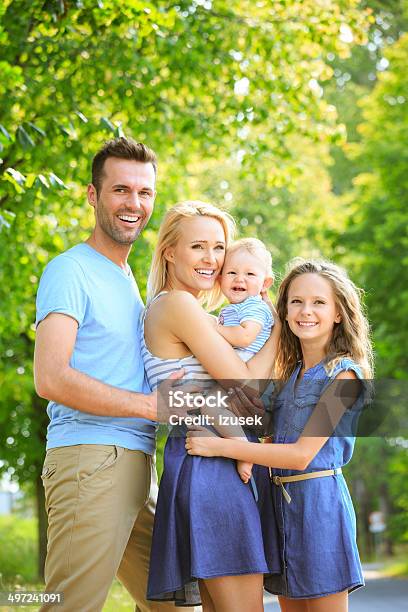 Happy Family In A Park Stock Photo - Download Image Now - Baby - Human Age, Family, Happiness