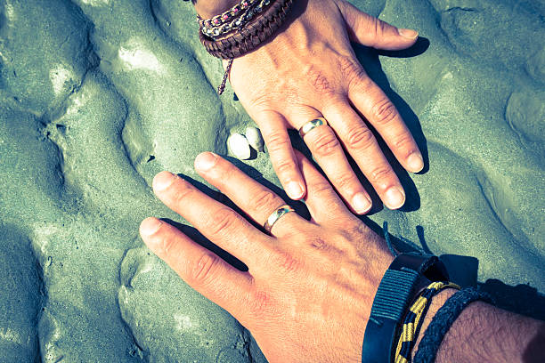 istock Couple holding hands together with their rings showing 497242031