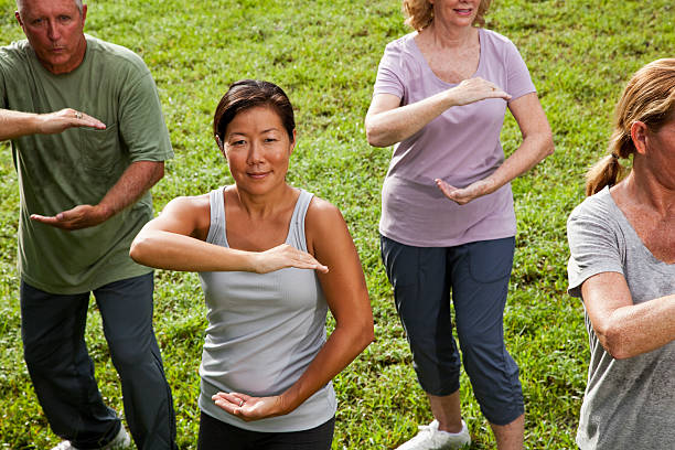istock Asian woman in tai chi class 497242271