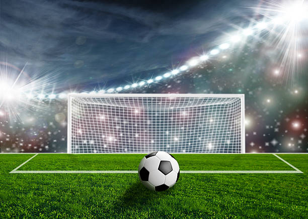 istock Soccer ball on green stadium arena 497242869