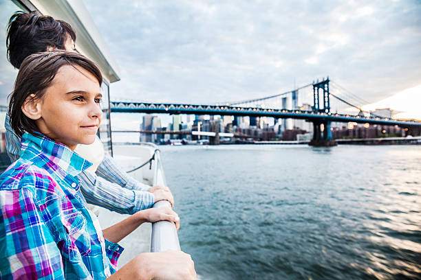 istock Mother and daughter at ferry at Hudson River 497242983
