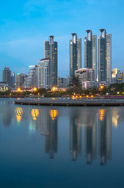 istock Bangkok cityscape reflect with lake at twilight time 497243135