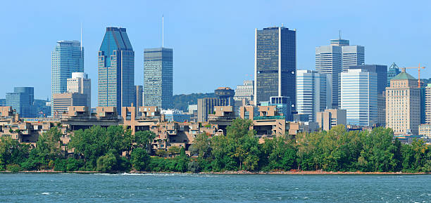 istock Montreal city skyline over river panorama 497243843