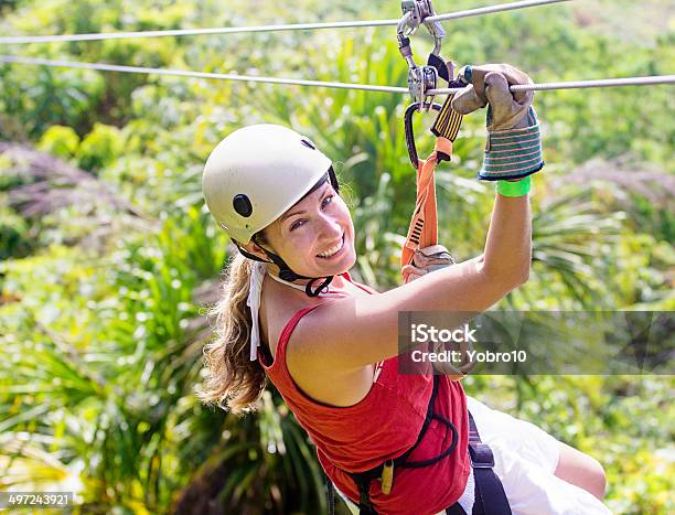 Woman Going On A Jungle Zipline Adventure Stock Photo - Download Image Now - Zip Line, Rainforest, Women