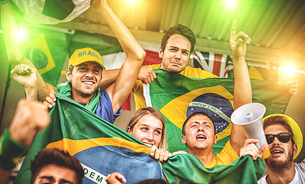 istock Group of brazilian supporters at stadium 497245325