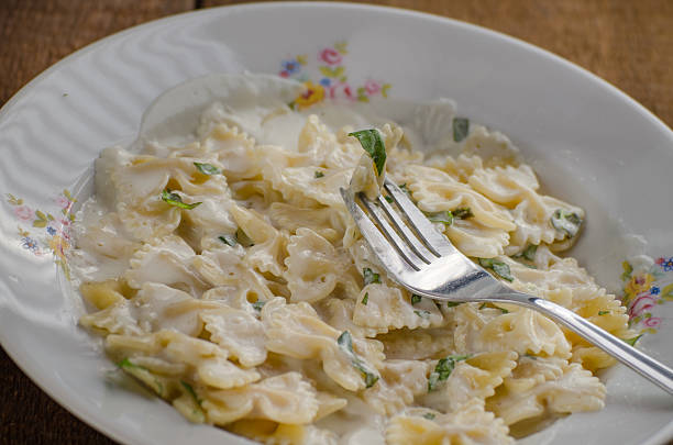 istock Fresh pasta with cheese, creame and basil 497246365