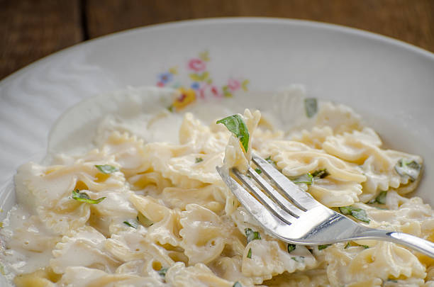 istock Fresh pasta with cheese, creame and basil 497246367