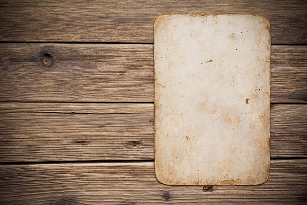 istock Old paper on the wood background 497246581