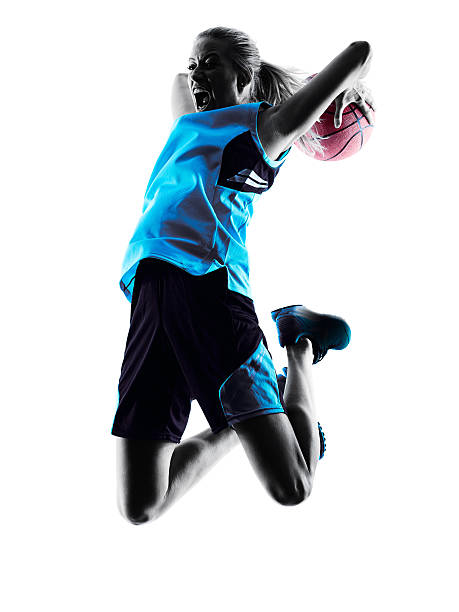 femme silhouette de joueur de basket-ball - womens basketball photos et images de collection