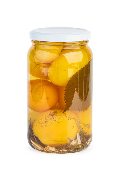 istock Glass jar with pickled yellow tomatoes 497248858