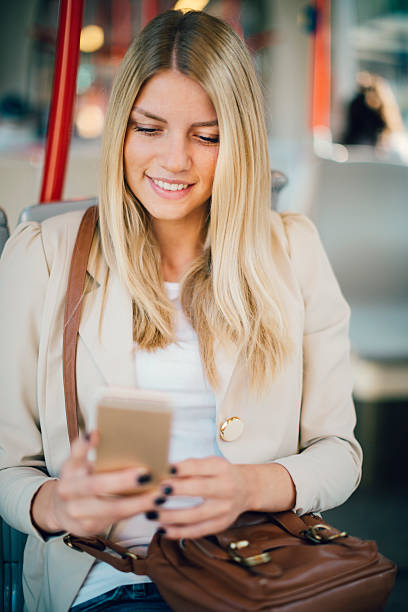 istock Young Woman Typing On Her Smart Phone In Public Transportation. 497251062