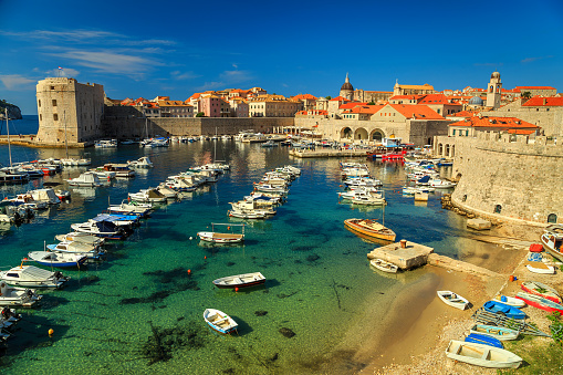Dubrovnik fortress panorama and harbor with boats and luxury yachts,Dalmatia,Croatia,Europe