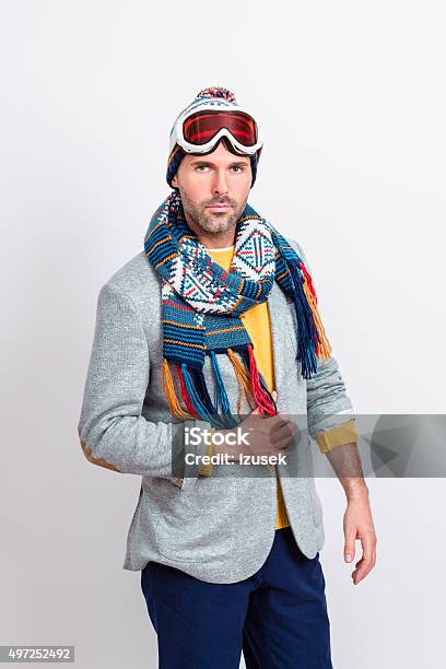 Handsome Man In Winter Outfit Stock Photo - Download Image Now - Skiing, Studio Shot, 2015