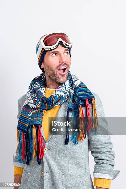 Surprised Handsome Man In Winter Outfit Stock Photo - Download Image Now - Men, Skiing, Studio Shot