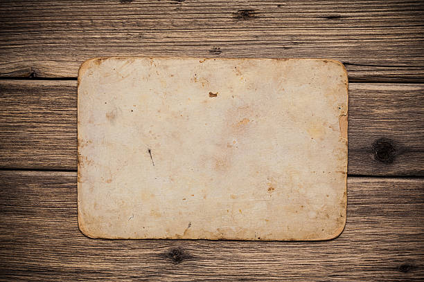 istock Old paper on the wood background 497252795