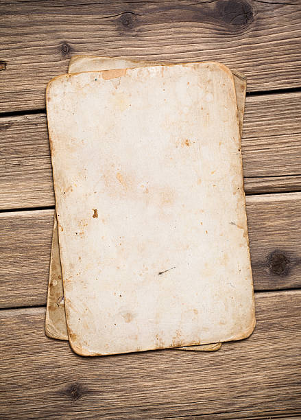 istock Old paper on the wood background 497252799