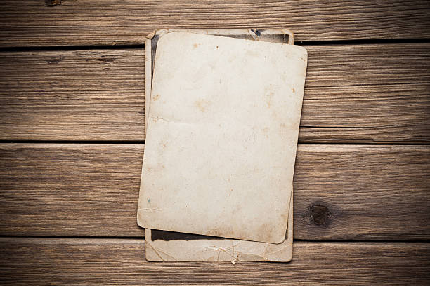 istock Old paper on the wood background 497252801