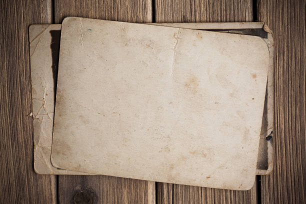istock Old paper on the wood background 497252805