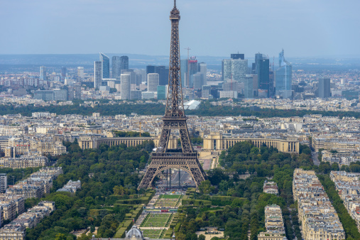 Aerial view of Eiffel Tower and La Defense business district taken from Montparnasse Tower in Paris, France