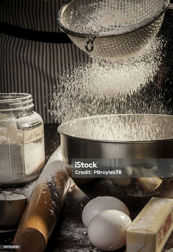 Flour Sifter in Action Flour sifter with stop motion action in kitchen. Activity Stock Photo
