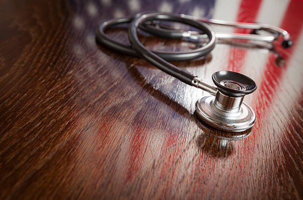 Stethoscope with American Flag Reflection on Table stock photo