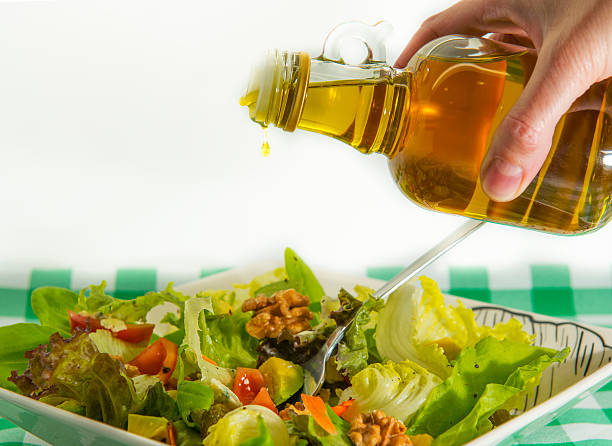 Green Salad Salad, healthy life olive oil pouring antioxidant liquid stock pictures, royalty-free photos & images