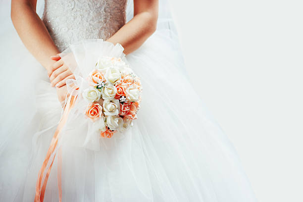 Wedding bouquet in hands of the bride