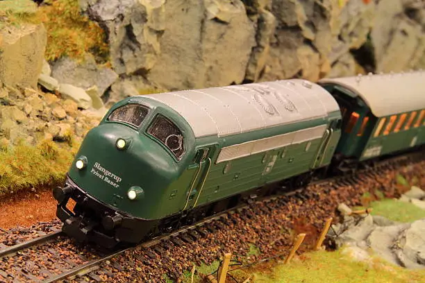 Scale Ho (1:87) model of diesel locomotive and train of Danish class MY privately painted in the colours of the photographers own fantasy railroad "Slangerup Privat Baner", which does not exist in reality. Model Railway type 3-rail AC.