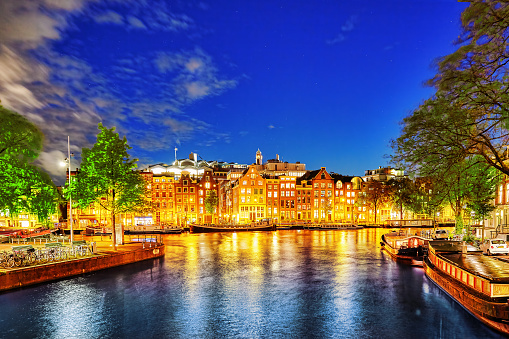 Beautiful Amsterdam city at the evening time. NetherlandsBeautiful Amsterdam city at the evening time. Netherlands