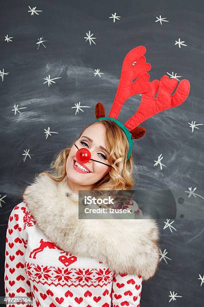 Happy Woman In Winter Outfit And Reindeer Antlers Headband Stock Photo - Download Image Now