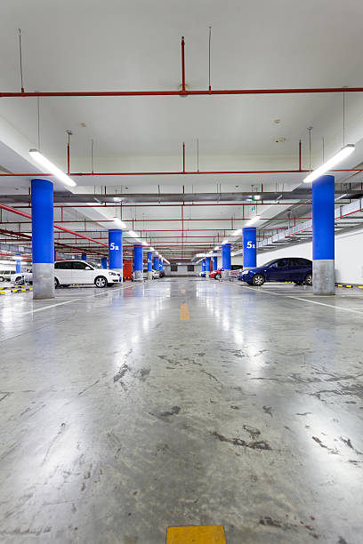 istock Parking garage, underground interior with a few parked cars 497255271