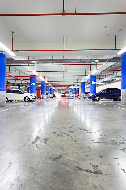 istock Parking garage, underground interior with a few parked cars 497255277