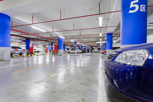 istock Front of blue car in underground parking garage 497255281