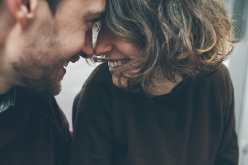 Vintage couple hugs and laughing .Coffee shop. instagram toned