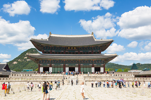 Seoul, South Korea - September 7, 2015: Tourists visit the Gyeongbokgung palace (former Royal palace) in Seoul. This building is the throne hall. 