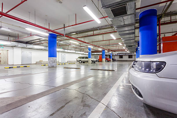 istock Parking garage, underground interior with a few parked cars 497257811