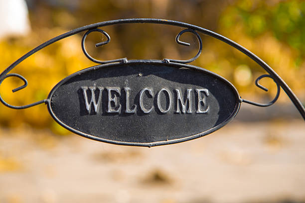 istock Decorative garden with Welcome Iron Signboard on Nature  background 497258224