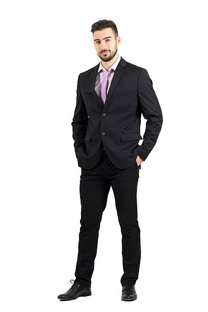 istock Confident young stylish man in suitwith hands in pockets 497258532